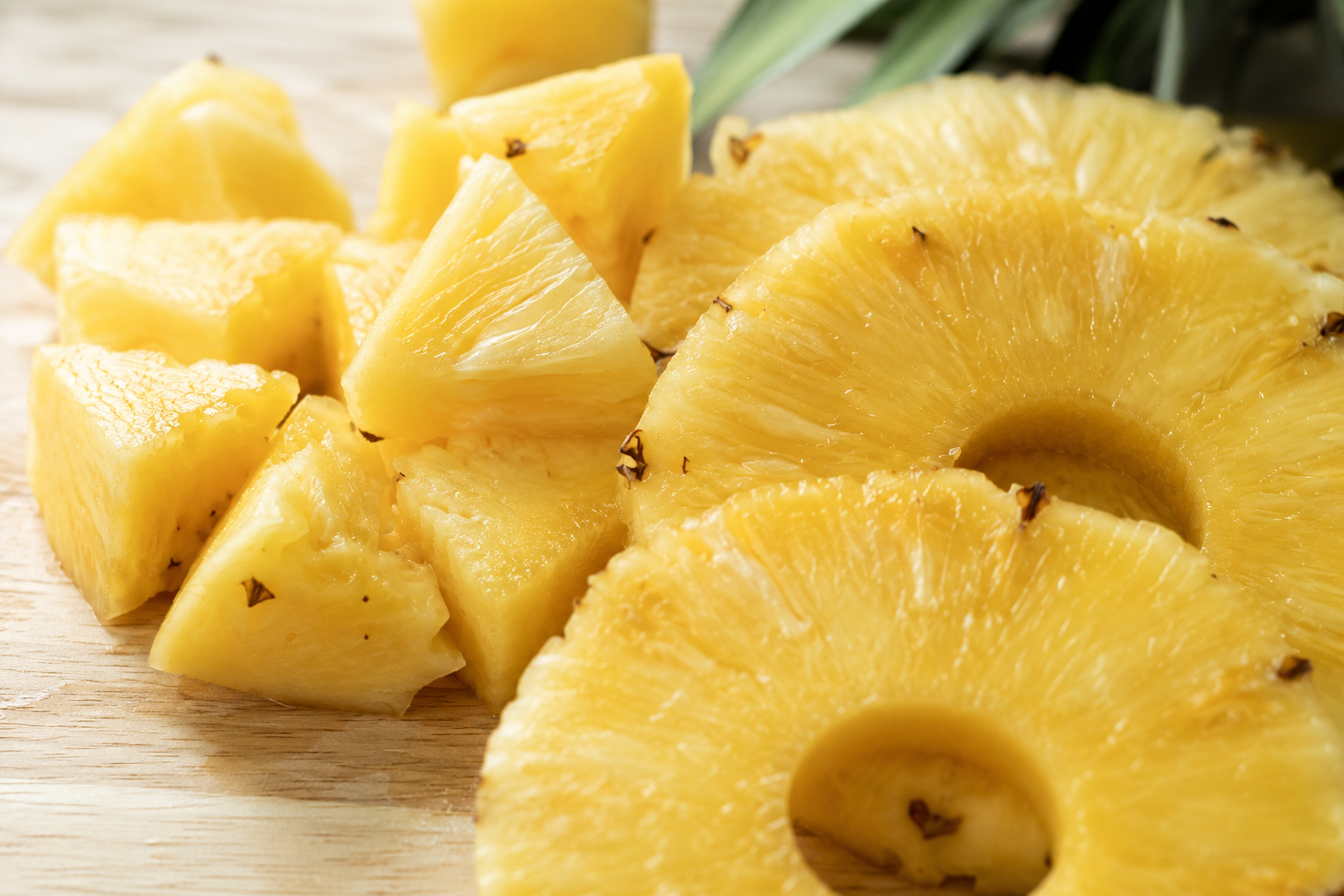 Pineapple slices on a wooden board